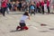 Female amateur photographer sitting on a street and making cool shot