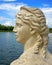 Female antique profile marble background on a pond