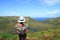 Female Appreciating the Breathtaking View of Rano Kau Crater Lake from Orongo Ceremonial Village on Easter Island, Chile