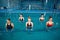 Female aqua aerobics, training with dumbbells