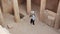 Female archeologist taking pictures of ancient buildings