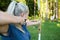 Female Archer Aiming Arrow At Target Board In Forest