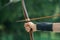 Female archer hand keeping bow