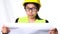 Female architect in a helmet looking at construction plans on a white background in studio. Beautiful woman civil engineer Looking