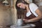 Female artisan creating a new piece in her ceramic studio