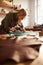 Female Artisan Working in Sunlit Shop