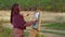 Female Artist Creating A Picture Of Autumn Time