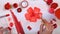 Female artist hands drawing red flower. Creative artist desk from above.