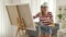 Female artist painting on a canvas