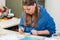 Female Artist working on stones mosaic