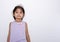 Female asian child girl standing with white background wearing accessories, crown and necklace purple dress