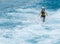 Female Asian freestyle skier landing in a practice pool