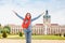 Female asian tourist in the baroque garden in front of the ancient architecture of royal Charlottenburg palace. Sightseeing