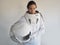 Female astronaut on a white background. Fantastic space suit. Exploration of outer space.