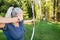 Female Athlete Aiming Arrow At Target Board In Forest