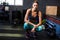 Female athlete crouching in fitness studio