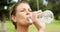 Female athlete drinking water