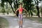 Female athlete exercising with resistance band in the park. Tough woman using a resistance band in her exercise routine.