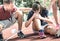 Female athlete getting injured during athletic run training - Male coach taking care on sport pupil after physical accident