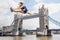 Female Athlete hurdling Tower Bridge