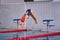 Female athlete jumps to the pool water.