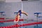 Female athlete jumps to the pool water.