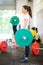 Female Athlete Lifting Barbell At Gym