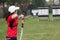 Female athlete practicing archery in stadium