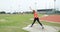 Female athlete practicing shot put throw at sports venue 4k