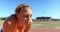 Female athlete standing on running track 4k