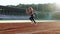 Female athlete starting her sprint on a running track. Runner taking off from the starting blocks on running track