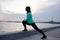 Female athlete training on the morning beach