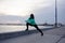 Female athlete training on the morning beach