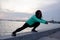 Female athlete training on the morning beach