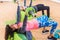 Female athletes doing barbell chest press lying on a Swiss ball during group training in fitness center