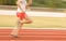 Female athletes running on the track