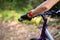 Female athletic standing with mountain bike in park