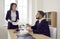 Female attorney and male judge discussing something during a trial in a court of law