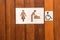 Female, baby changing and handicap toilet sign