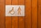 Female, baby changing and handicap toilet sign