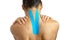 Female back with physio tape on white background