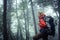 Female backpacker forest hiking.