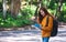 A female backpacker looking for direction on the map while traveling on a mountains road