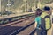 Female backpacker waiting at train station.