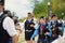 Female bagpiper in pipe and drum corps