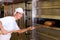 Female baker baking bread