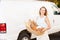 Female Baker Delivering Bread Standing In Front Of Van