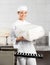 Female Baker Holding Packed Bread Loaf