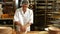 Female baker kneading a dough