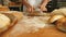 Female baker kneading a dough